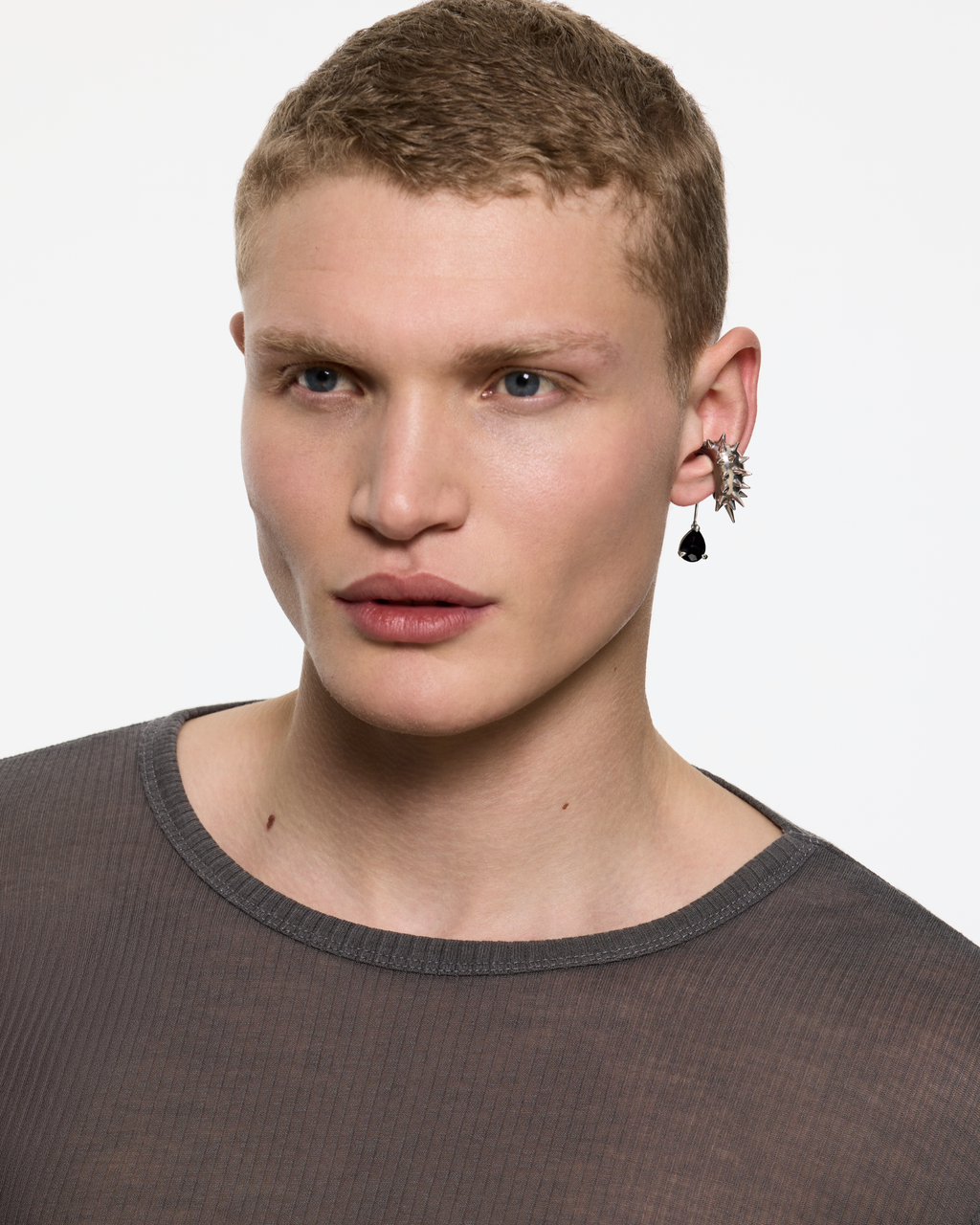 Model wearing the Blown Drop Spike Black Onyx Ear Cuff in Rhodium Vermeil with a faceted black onyx drop pendant by Alan Crocetti.