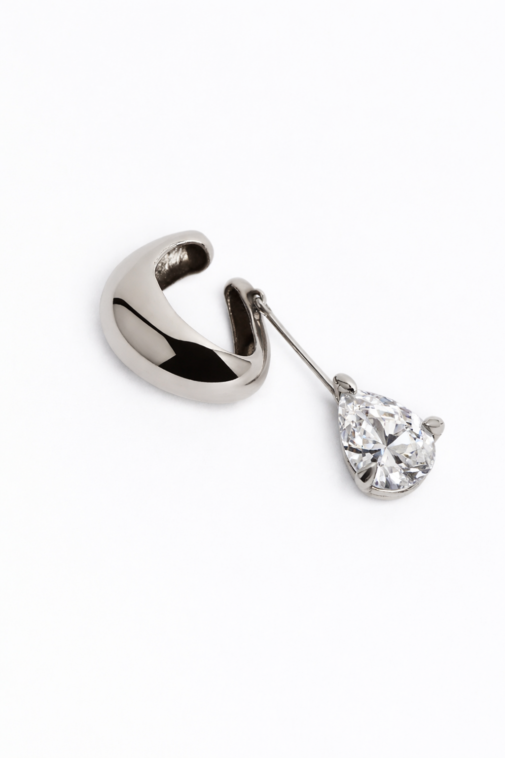 Silver earcuff with a pear-shaped gem on a white background