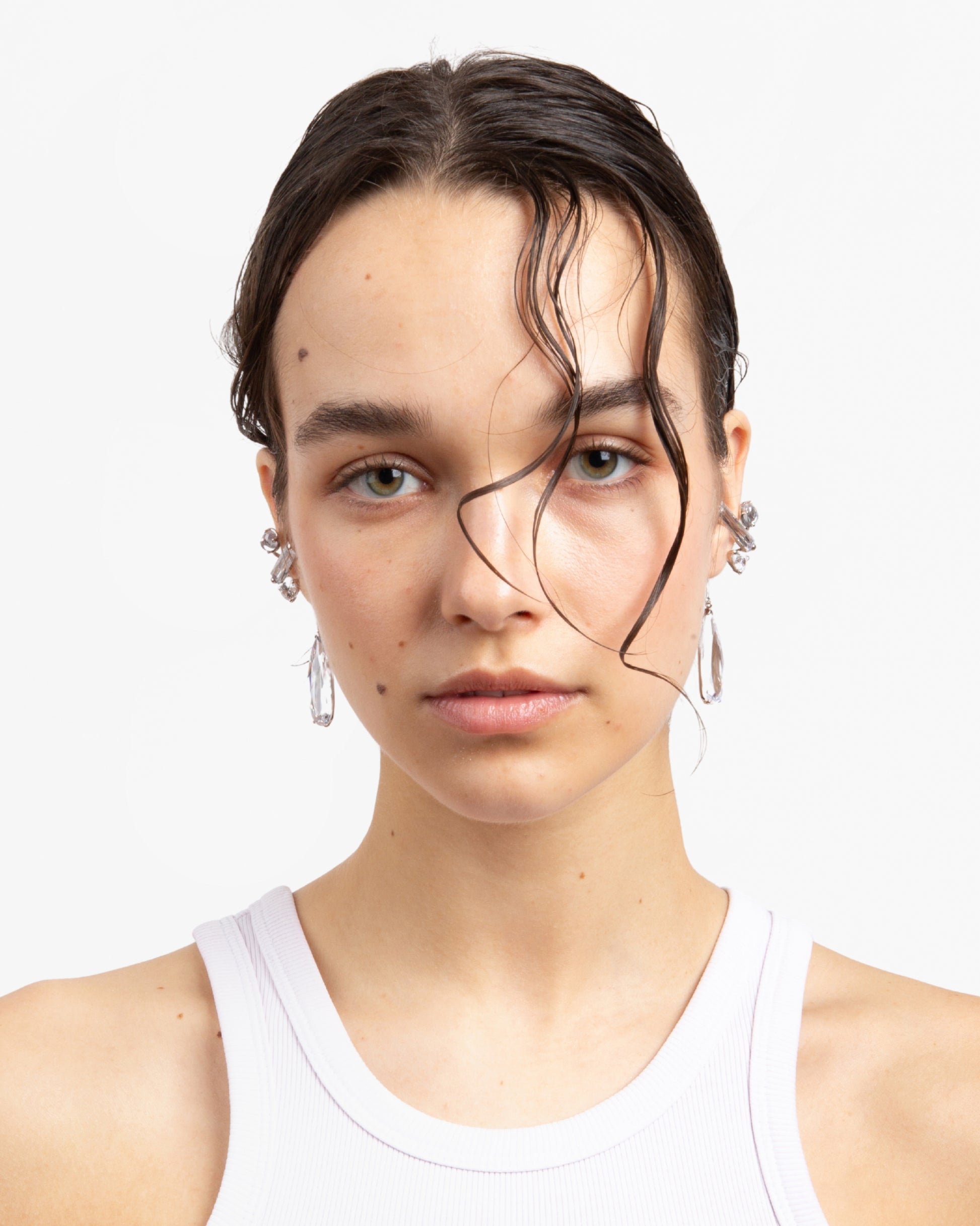 Model wearing pair of Alan Crocetti Clear Mixed Hybrid Drop Ear Cuff in Rhodium vermeil 