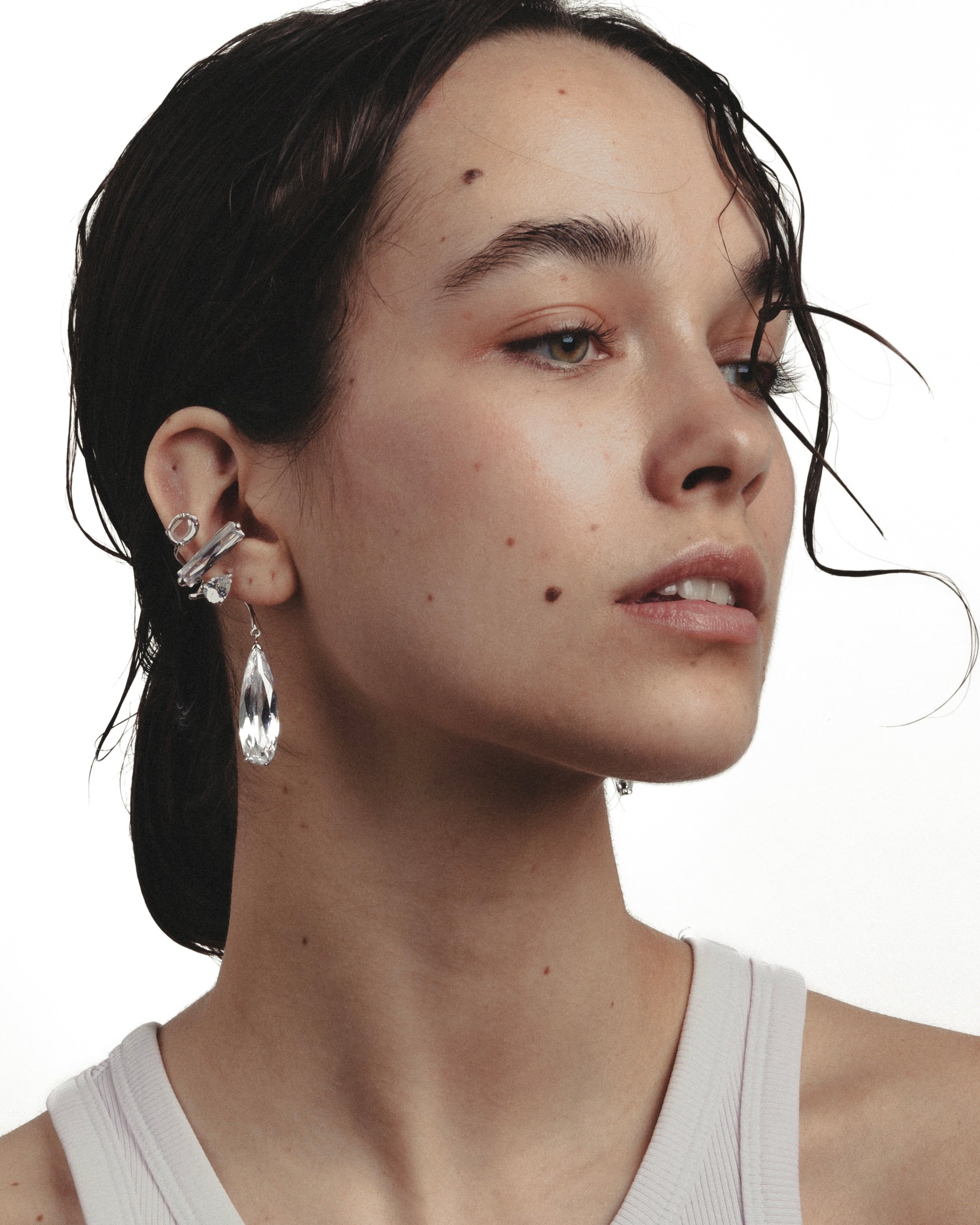 Close up model wearing Clear Mixed Hybrid Drop Ear Cuff in Rhodium vermeil with mixed clear crystals