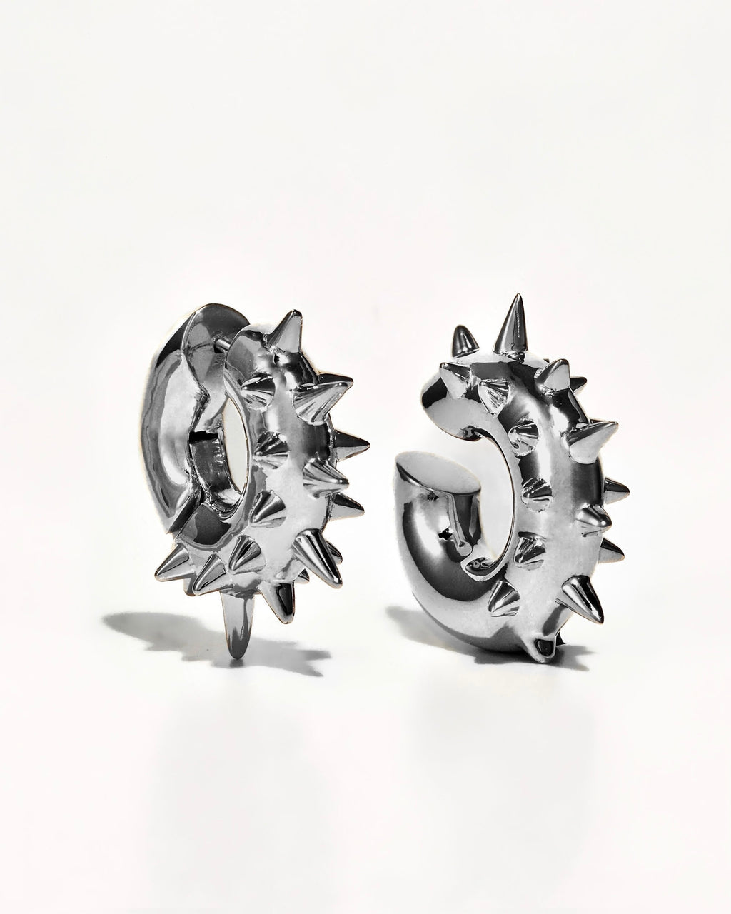 925 Sterling Silver Rhodium Plated spike ear set icluding an earring and earcuff on a white background