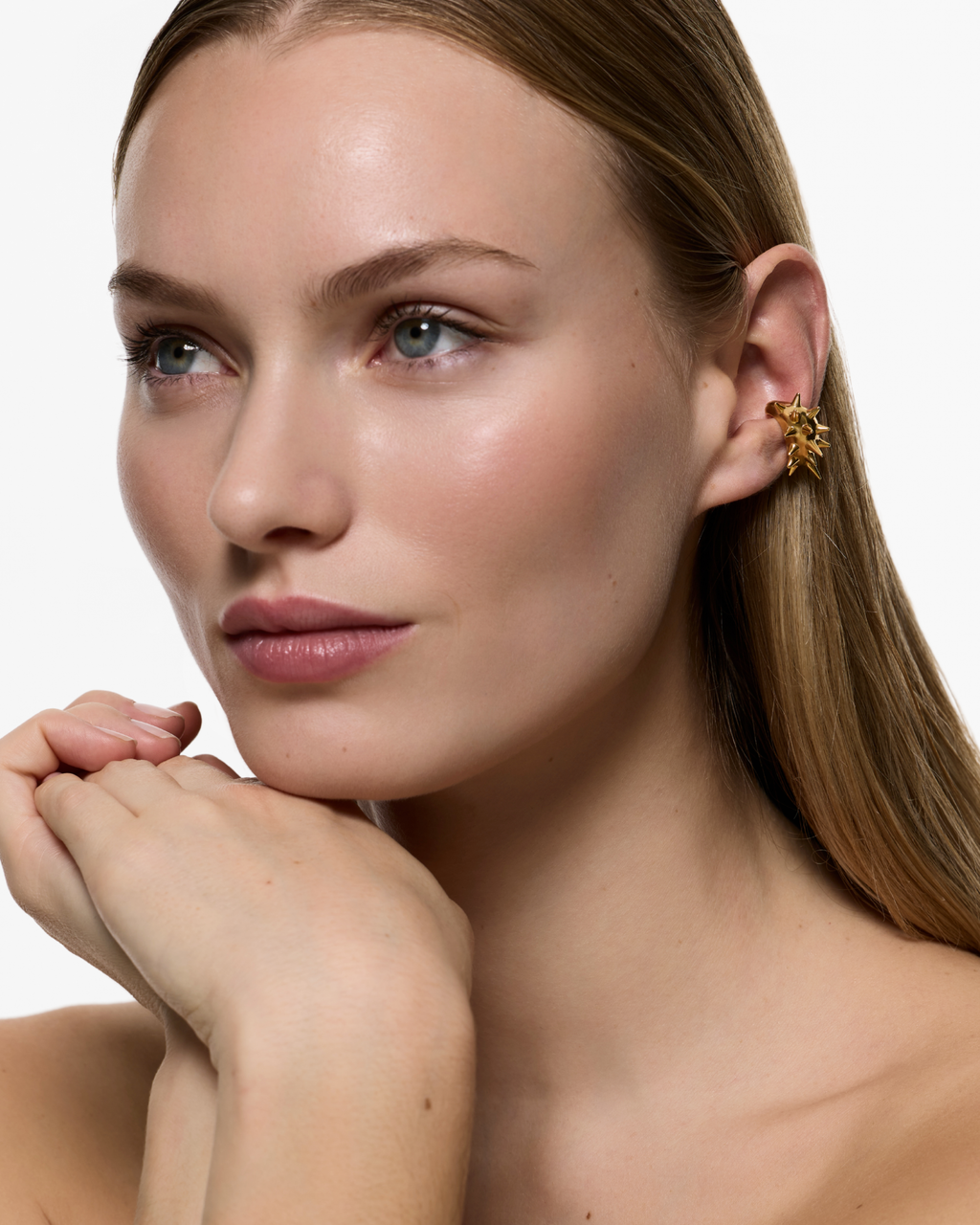 Model wearing the Gothika Nano Blown Earcuff in Gold Vermeil positioned on the ear without a piercing.