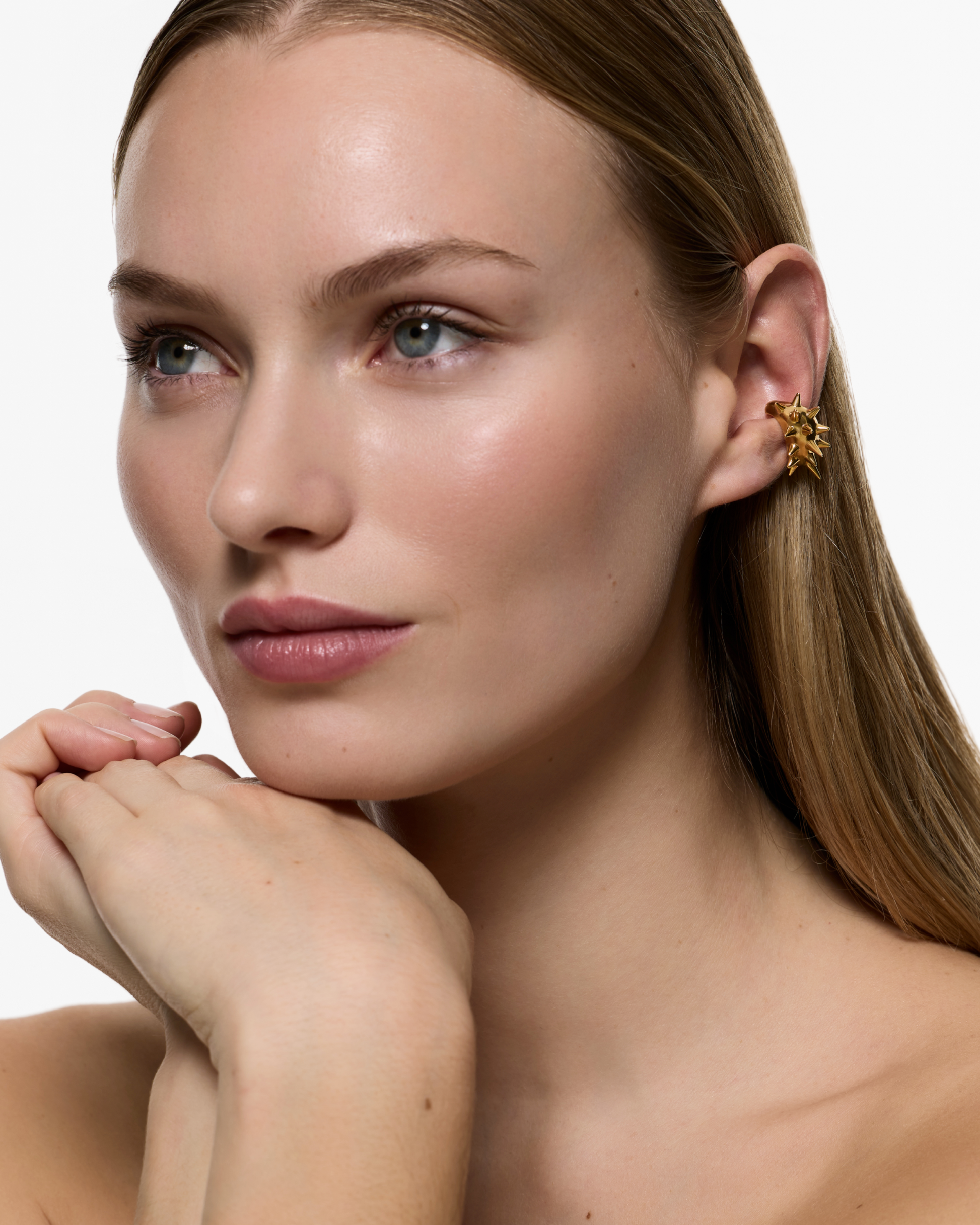 Model wearing the Gothika Nano Blown Earcuff in Gold Vermeil positioned on the ear without a piercing.