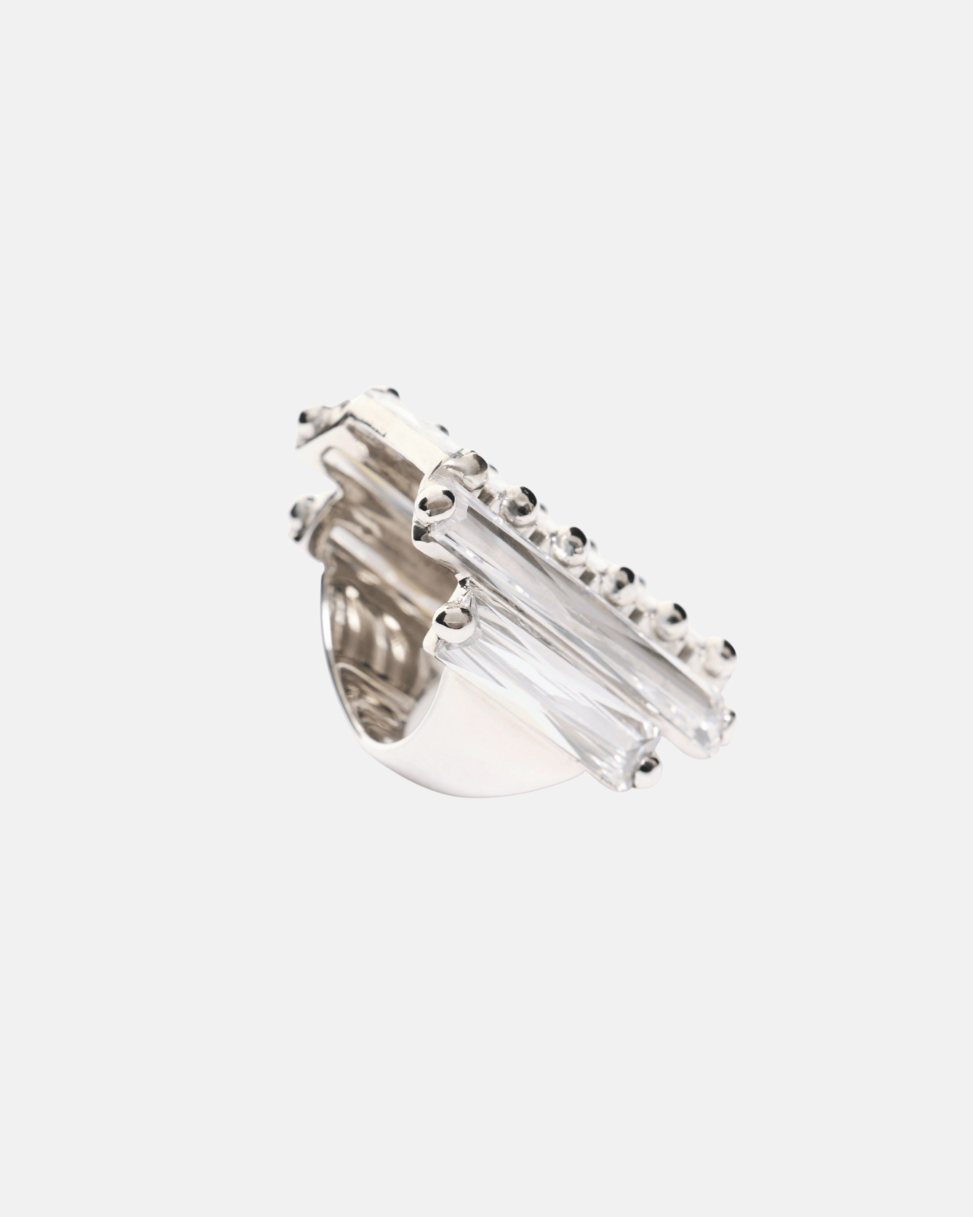 Side view of the Maxi Crystallised Armour Clear Ring in Rhodium Vermeil featuring architectural rows of baguette-cut clear cubic zirconia.