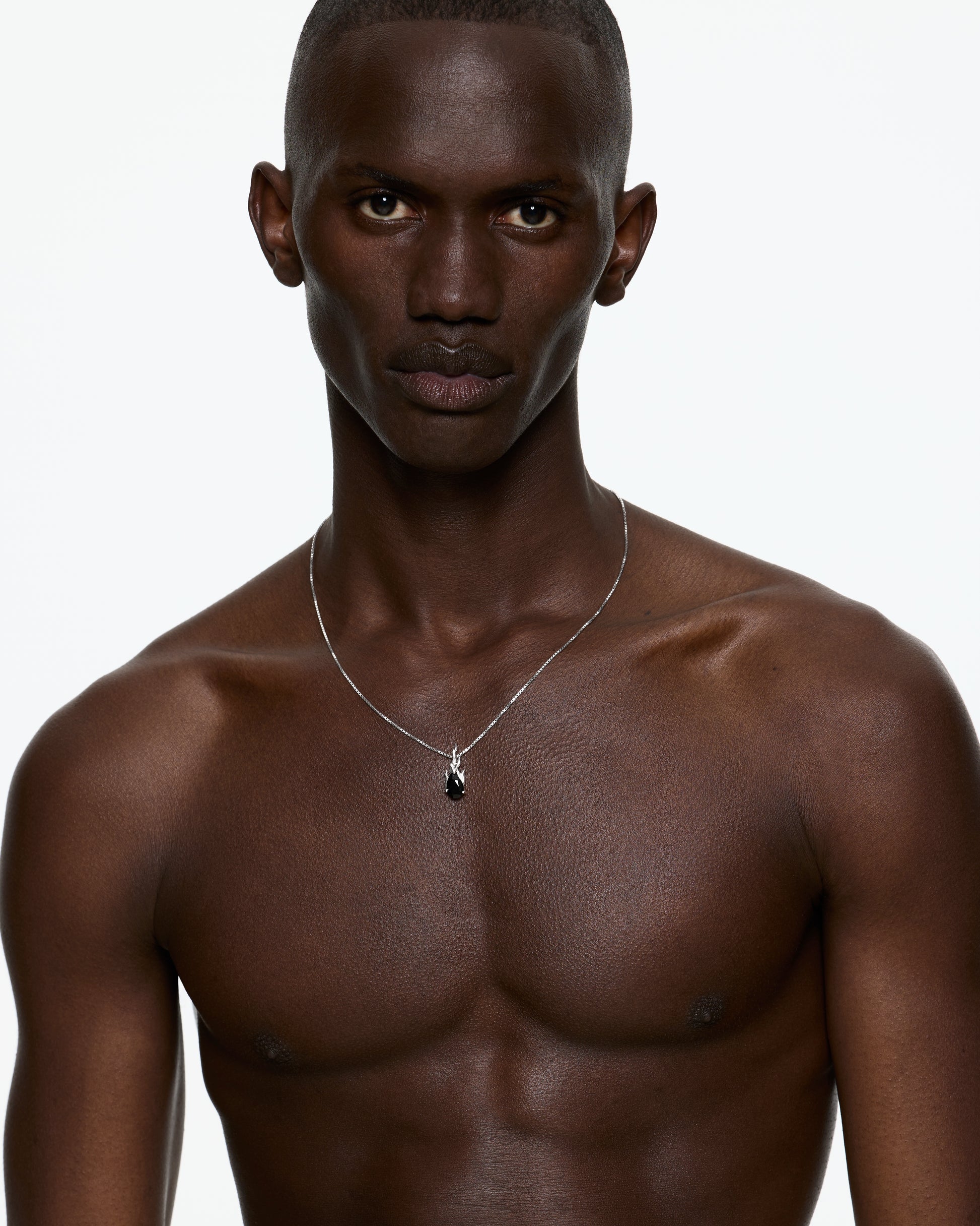 Model wearing Alan Crocetti Gem In Heat Black Onyx Necklace in rhodium vermeil