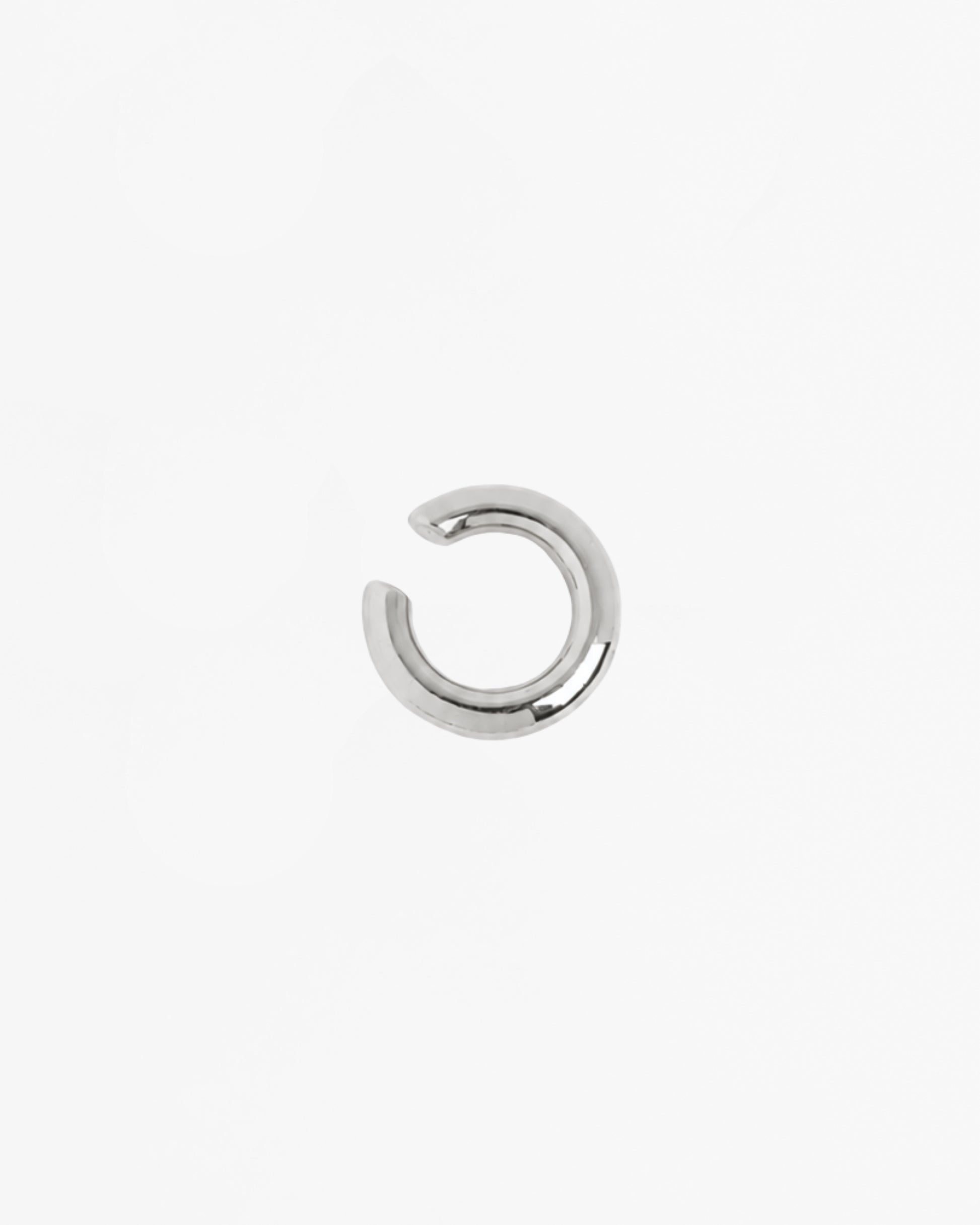 Mini Loophole Earcuff in rhodium vermeil featuring a smooth sculptural loophole aesthetic in sterling silver design by Alan Crocetti