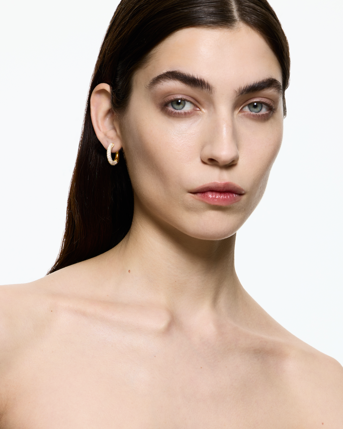 Mini Loophole Encrusted Earring — gold vermeil sterling silver sculptural hoop with clear pavé by Alan Crocetti worn by femal model