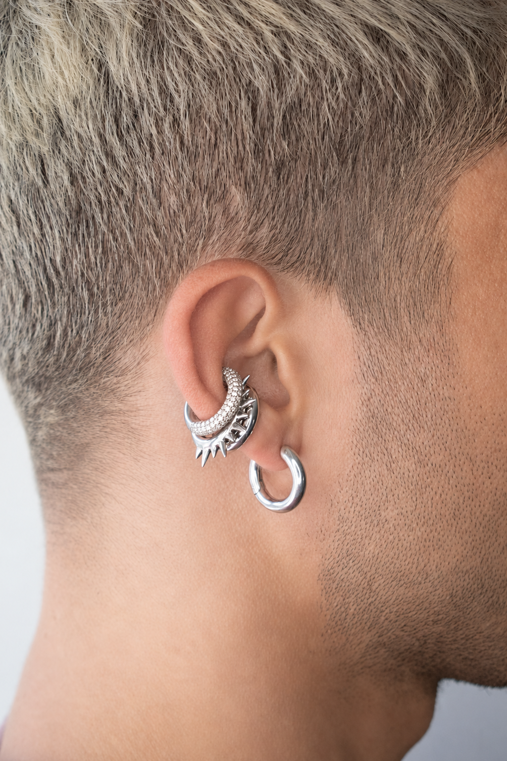 Mini Loophole Earcuffs and earring in Rhodium vermeil featuring a smooth sculptural loophole aesthetic in sterling silver by Alan Crocetti