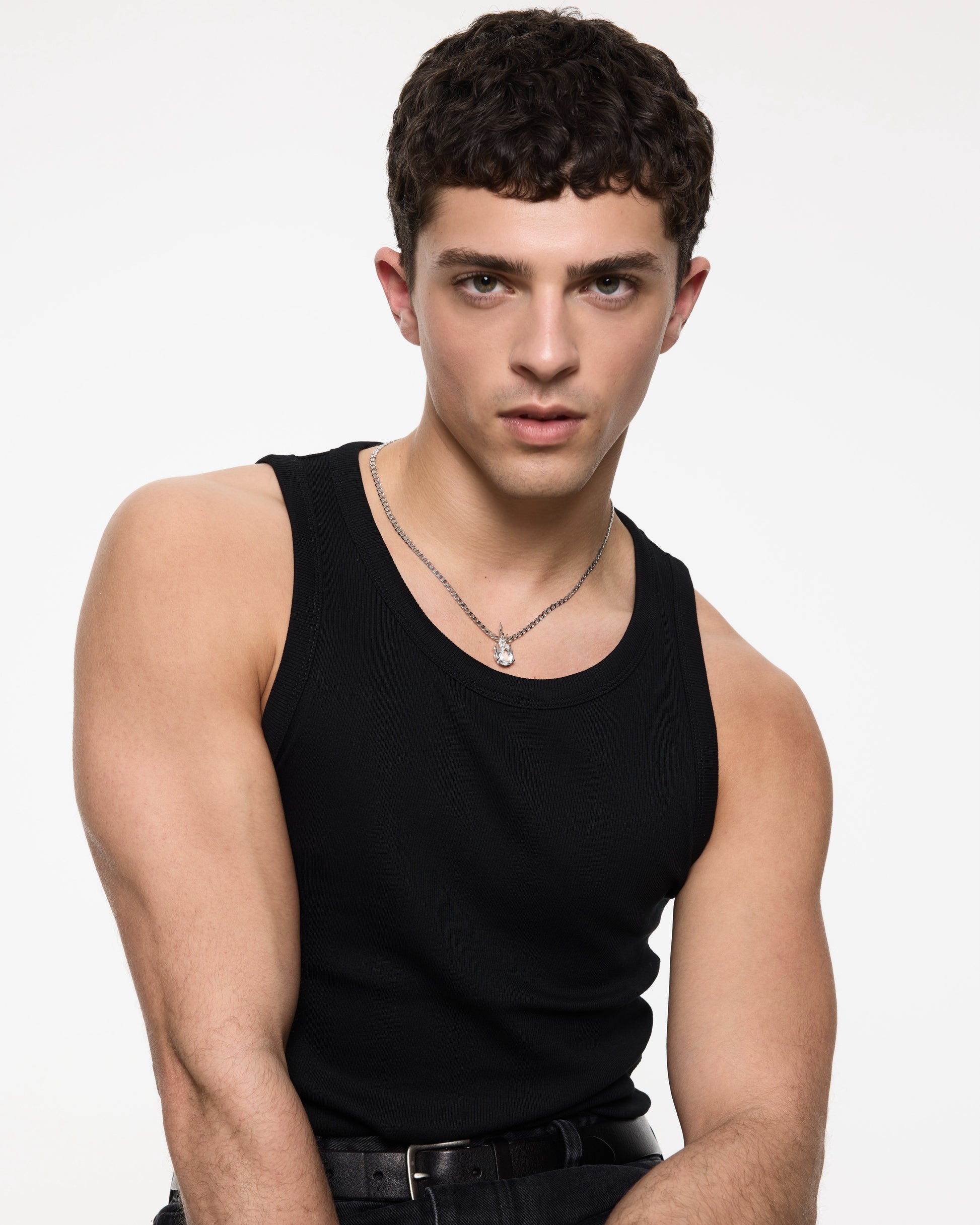 Model wearing Gem in Heat curb white topaz flame pendant necklace in rhodium vermeil on curb chain