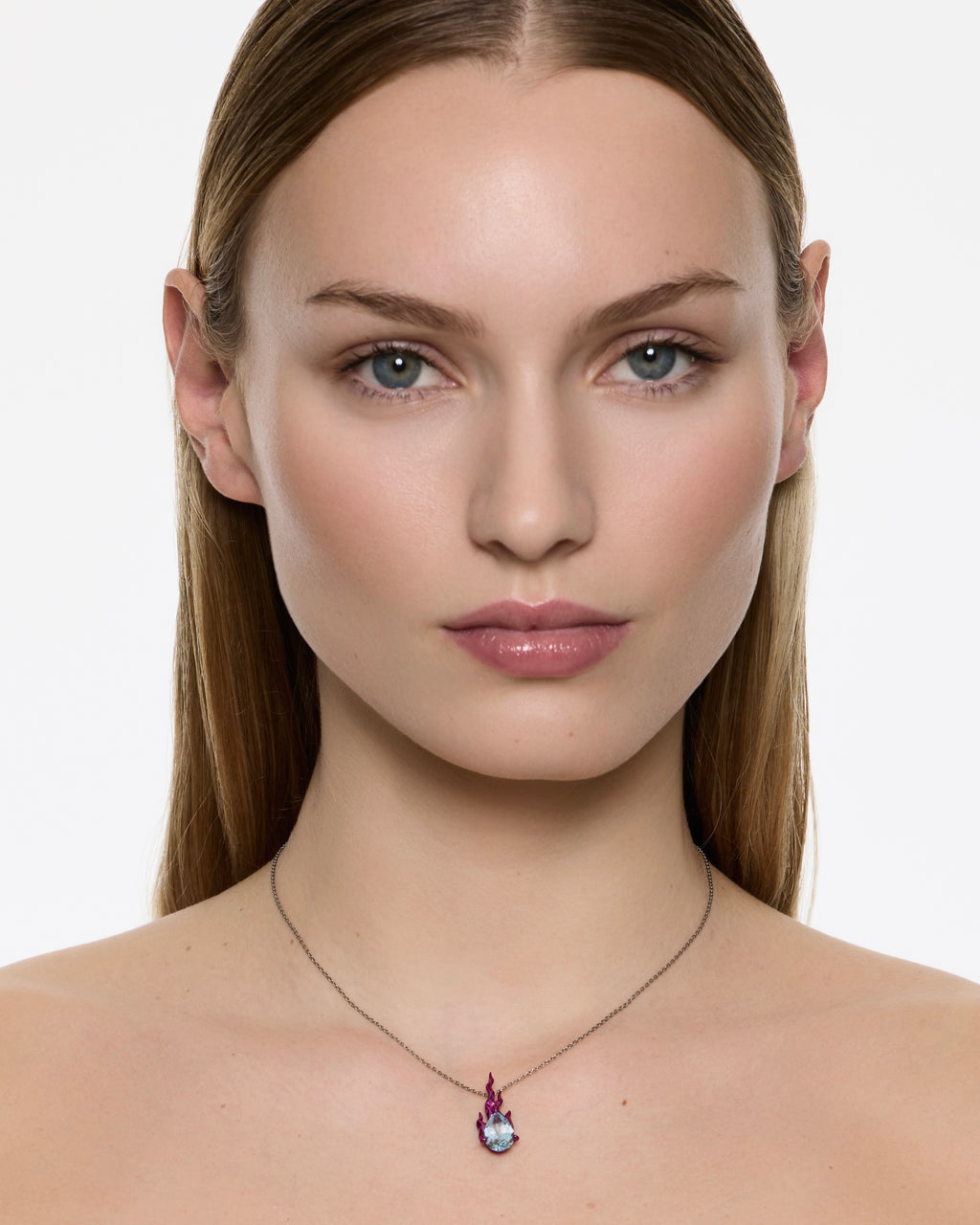 Model wearing Mini Pink Gem in Heat sky topaz necklace in rhodium vermeil on fine chain