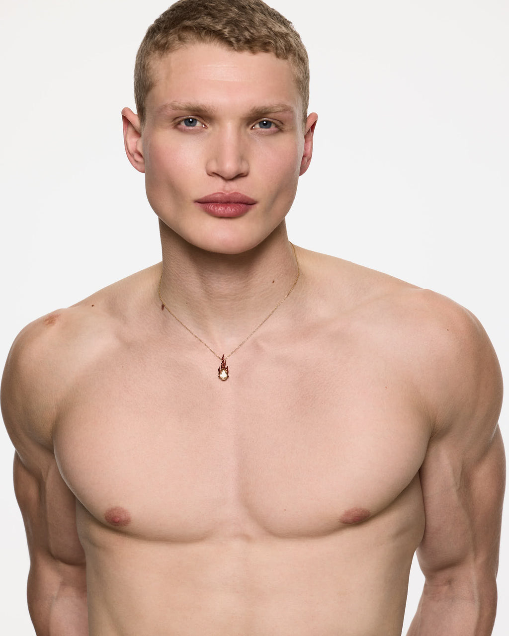 Male model wearing Mini Red Gem in Heat yellow citrine necklace in gold vermeil
